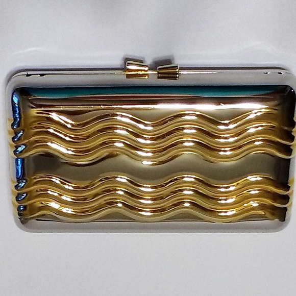 Handbags - silver-tone with gold-tone wave metal clutch